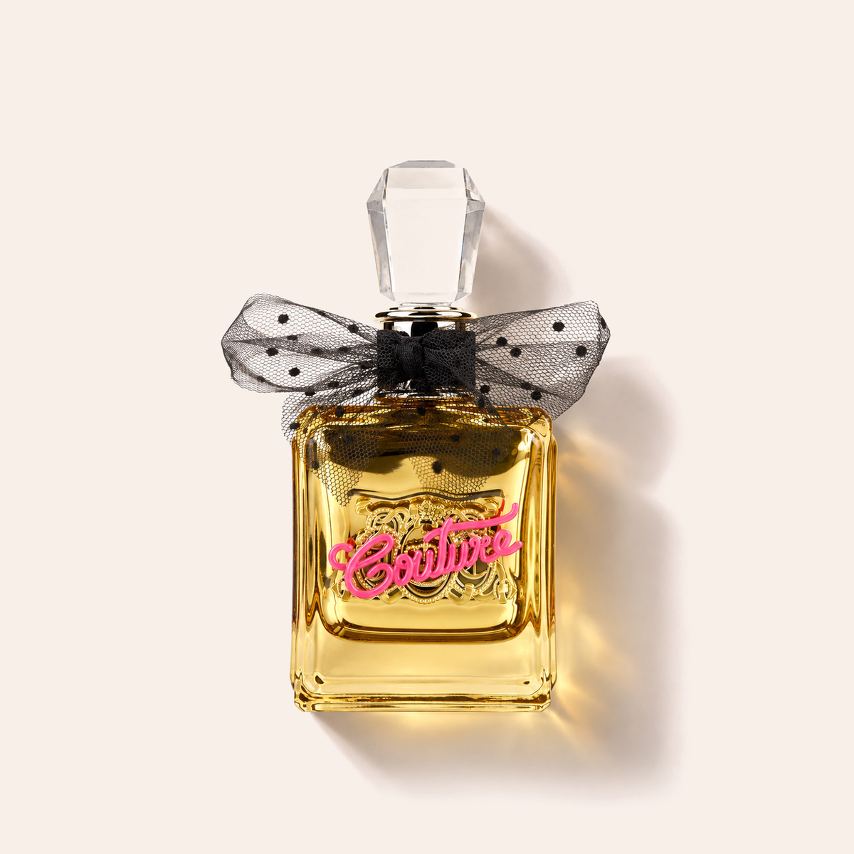 Juicy Couture Viva la Juicy Gold Couture EDP 100 ml, flakon vleže na béžovém pozadí – MrRizz