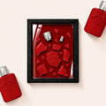 Parfemovy obraz Parfums de Marly Kalan v cernem ramu - ilustracni fotografie