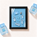 Parfemovy obraz Freeze Riiffs Perfumes v cernem ramu - ilustracni fotografie